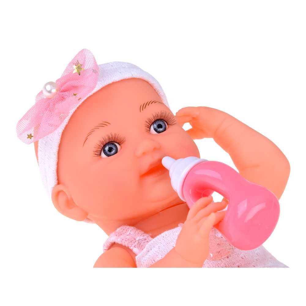 Rubber baby doll in a pink dress, bottle, pacifier ZA5235