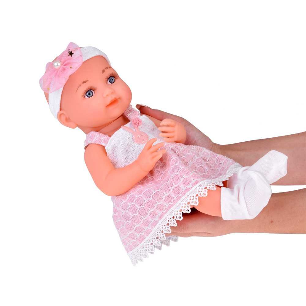 Rubber baby doll in a pink dress, bottle, pacifier ZA5235