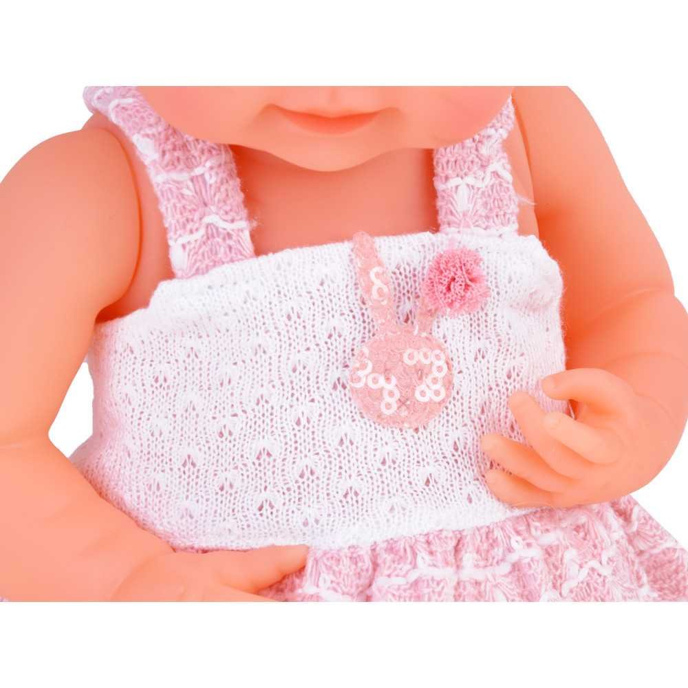 Rubber baby doll in a pink dress, bottle, pacifier ZA5235